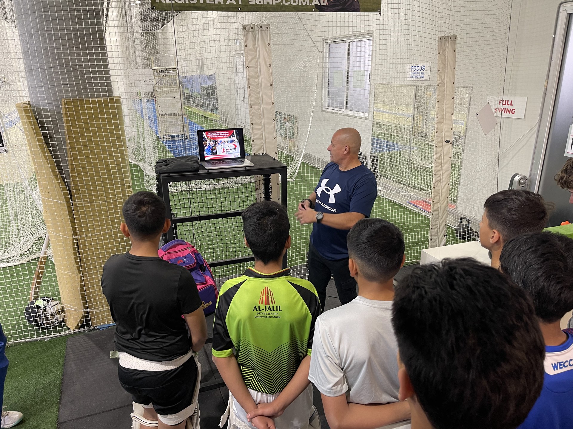 Coach briefing players at Stars Cricket Academy